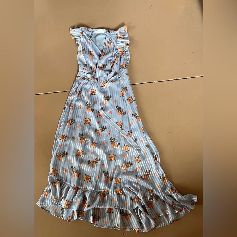 Blue ruffled v neck maxi dress with floral design